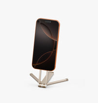 UNIQ Arcus magnetic tripod Champagne Volt holding an iPhone
